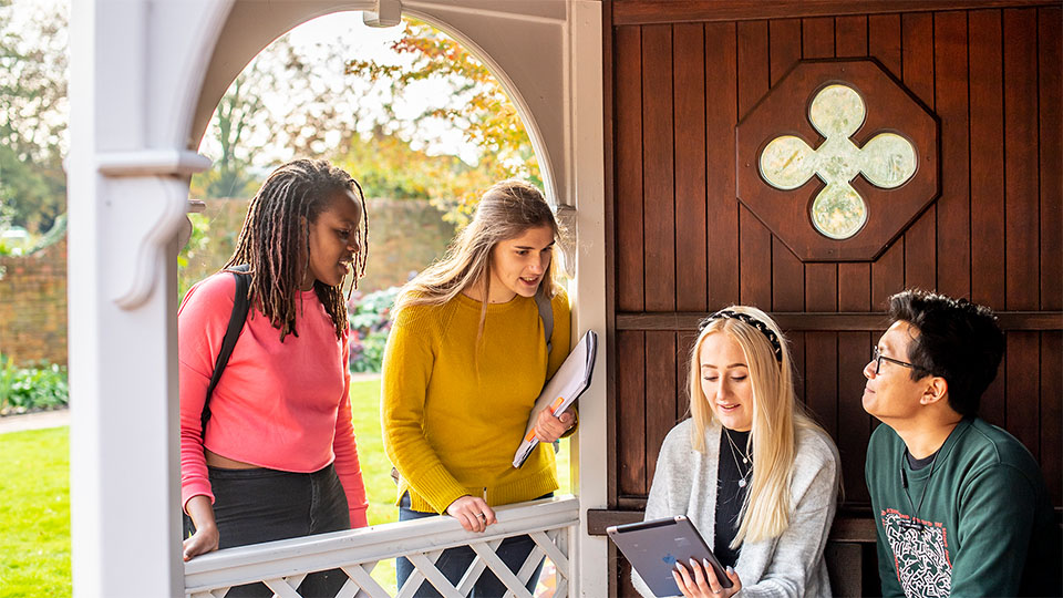 Students chatting to one another outside.